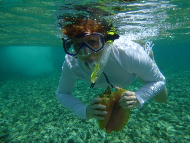 Showing off a conch shell... that I couldn't keep. 